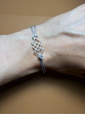 Silver Tone Endless Love Knot Cord Bracelet - Grey Blue